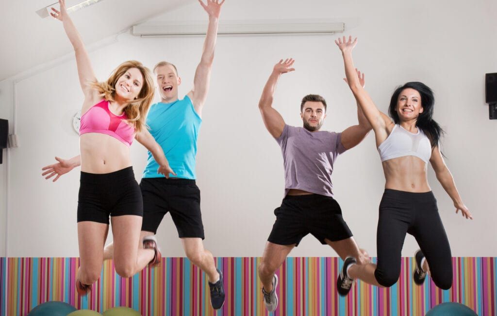 Pilates teachers happy during jump exercise