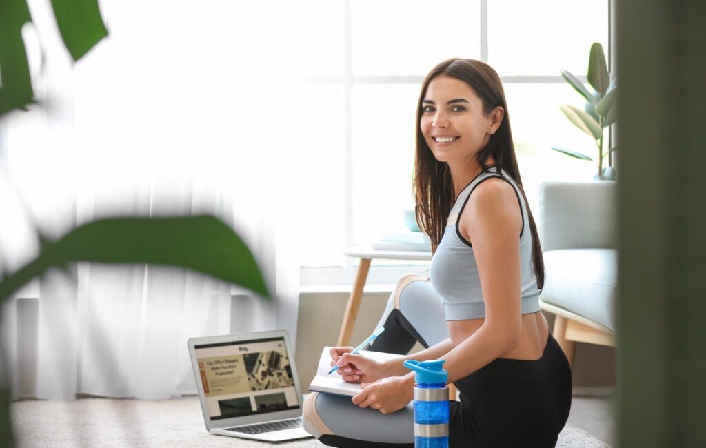 fit woman busy working on her laptop