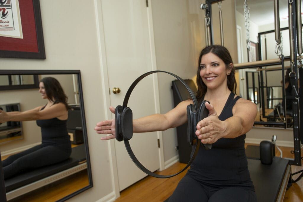 Christina Lundeen, Pilates teacher doing magic circle workout