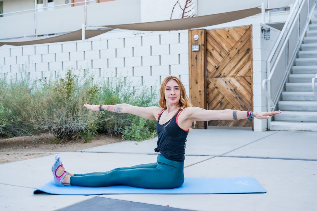 Lesley Logan, Pilates business/studio owner doing her Pilates mat exercises outdoor