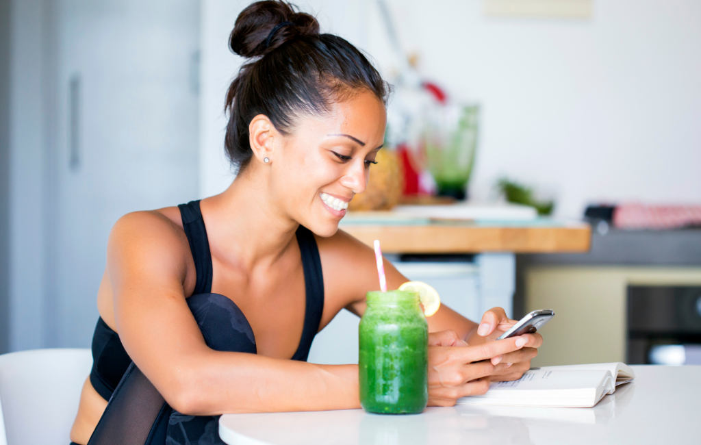 Fitness woman busy checking her phone